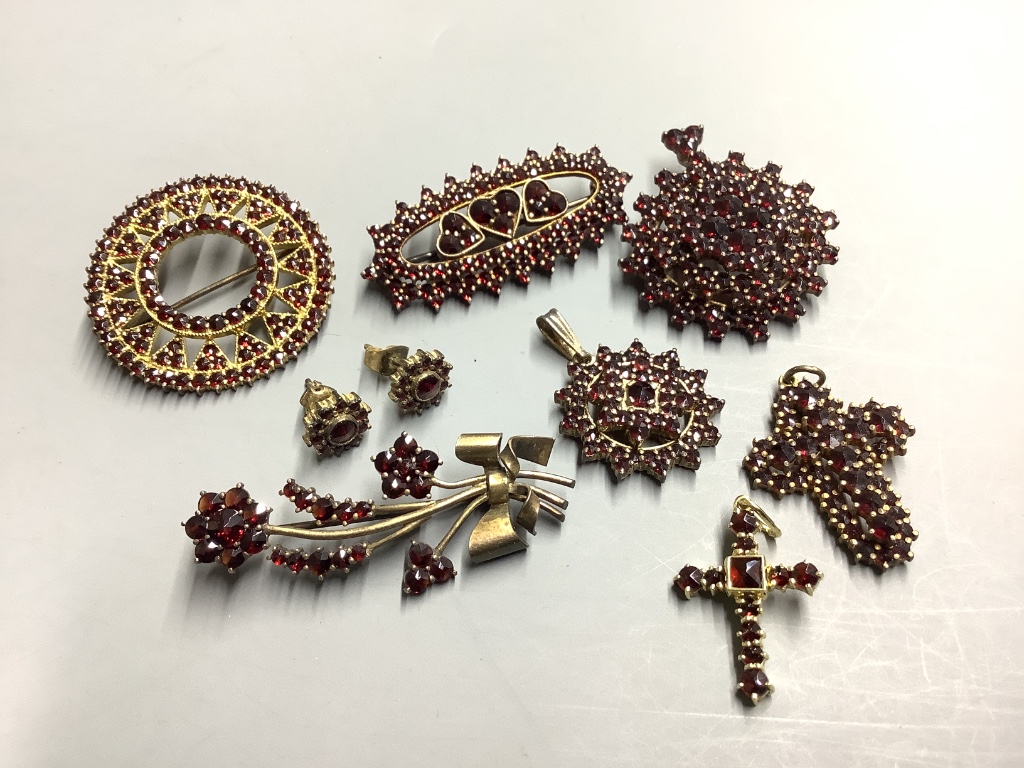 A group of facetted garnet set jewellery, including brooches, pendants and ear studs